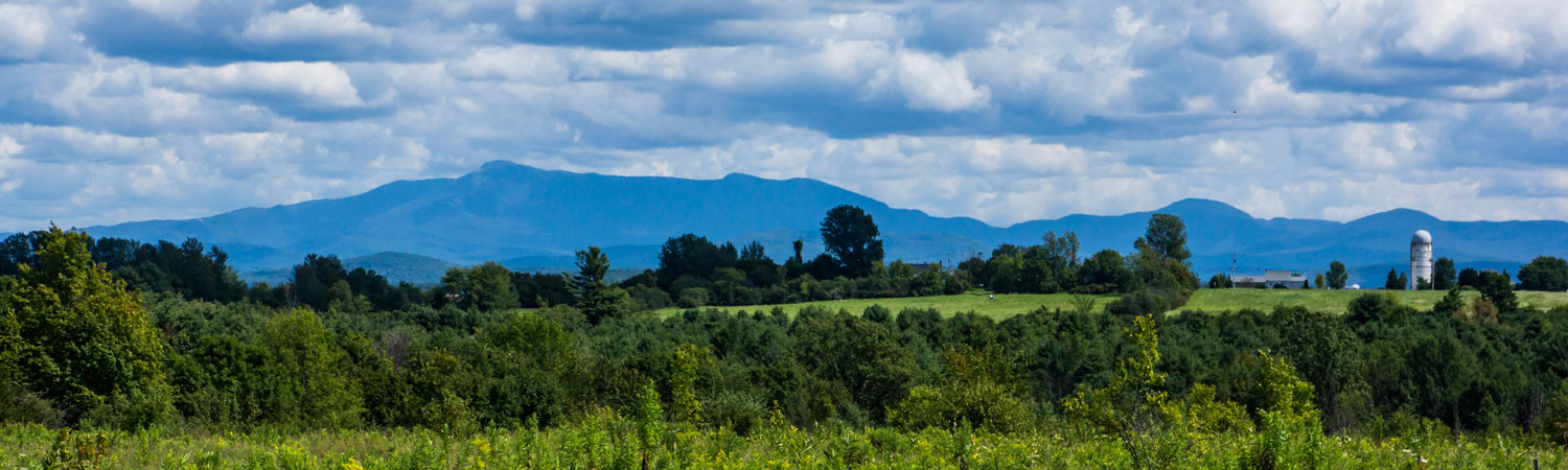 Vermont farm with mountains in distance